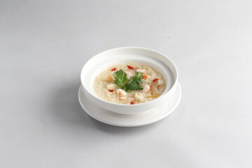 healthy seafood prawn herbal poached rice porridge soup in bowl on white background chinese banquet halal menu