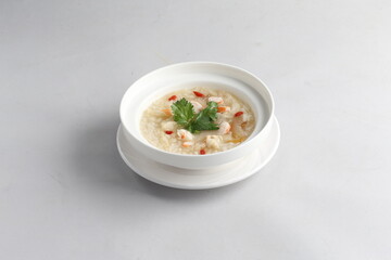 healthy seafood prawn herbal poached rice porridge soup in bowl on white background chinese banquet halal menu