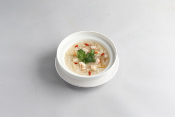 healthy seafood prawn herbal poached rice porridge soup in bowl on white background chinese banquet...