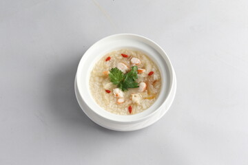 healthy seafood prawn herbal poached rice porridge soup in bowl on white background chinese banquet halal menu