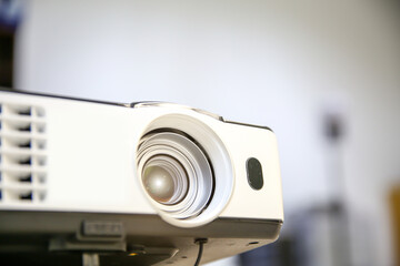 Close-up computer projector on table boardroom or meeting room technology equipment of visual or visualizer for presentation interview or classroom meets tool.