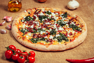 Tasty pizza on wooden background