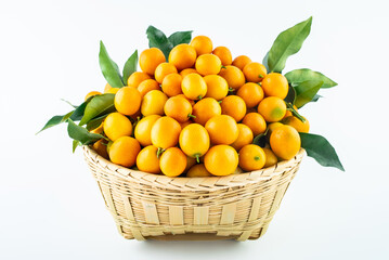 Bamboo basket full of fresh kumquats