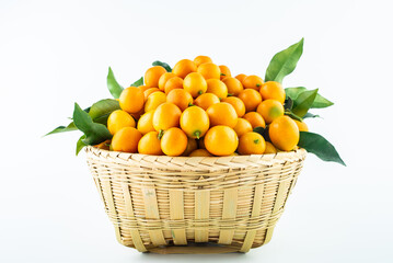 Bamboo basket full of fresh kumquats