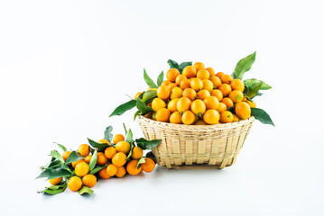Bamboo basket full of fresh kumquats
