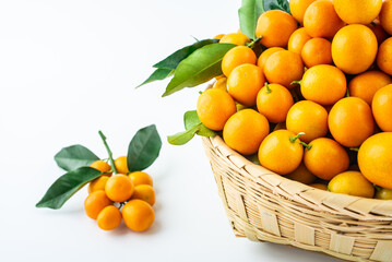 Bamboo basket full of fresh kumquats