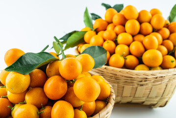 Bamboo basket full of fresh kumquats