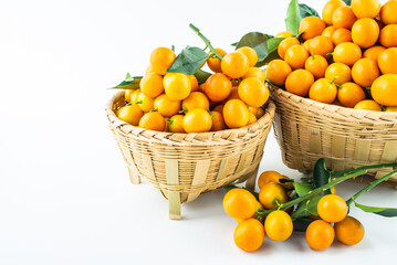 Bamboo basket full of fresh kumquats