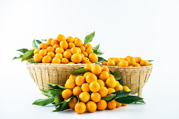Bamboo basket full of fresh kumquats