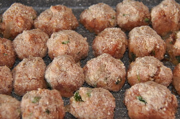 Meatballs with parsley and in breadcrumbs and tomato sauce with spices. Delicious meat dinner dish for potatoes and salads.