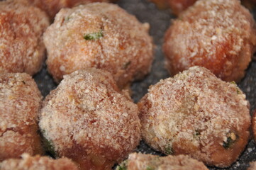 Meatballs with parsley and in breadcrumbs and tomato sauce with spices. Delicious meat dinner dish for potatoes and salads.