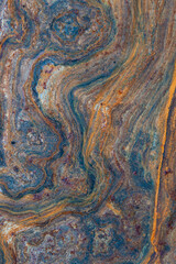 grunge background: curly rust on an old metal surface, toning