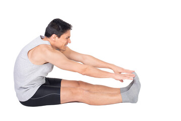 Determined man in sportive wear stretching hamstrings