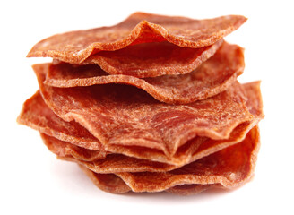 A stack of meat chips is isolated on a white background. Full clipping path.