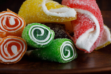 Beautiful multicolored Turkish delight on a ceramic plate. Turkish sweets . Delicious candies .