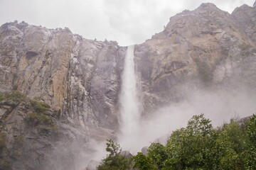 Fototapeta na wymiar Waterfall in Yosemite on a rainy day , California, USA