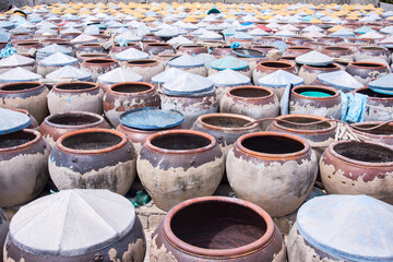 Fototapeta premium Photo of traditional craft villages: jars containing fish sauce. Time: Sunday morning, February 6, 2022. Location: Binh Thuan province