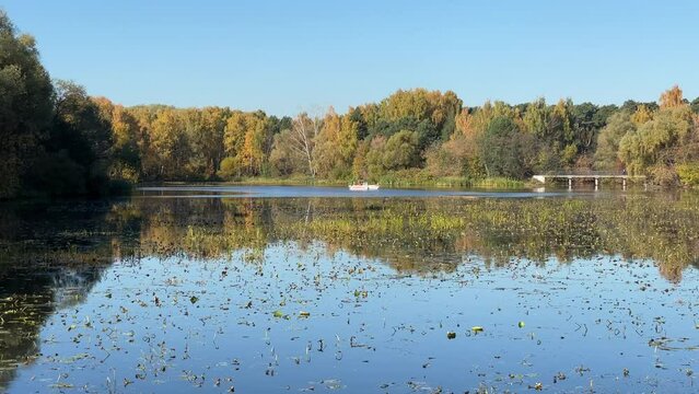 4K bright sunny autumn morning video of foggy Moscow River and yellow red forest in Moscow, Russia