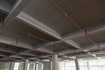 Indoor concrete structure ceiling and fire pipes