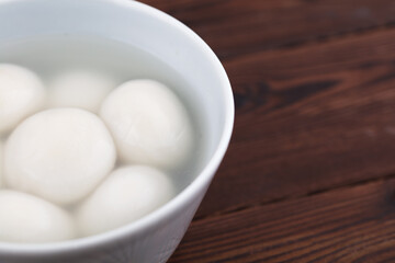 A bowl of cooked glutinous rice balls partially and blank
