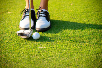 Golfer Woman playing golf People swing and hitting golf course is on the fairway. Hobby in holiday...