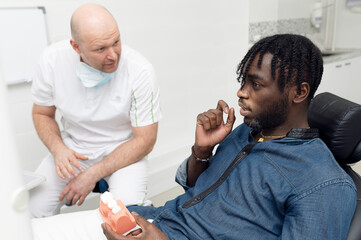 Fototapeta premium Doctor talking to senior patient.