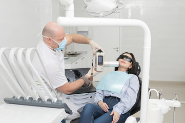 Dentist and patient in dental clinic