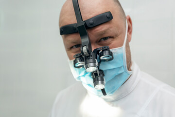 Close-up of a dentist holding a stethoscope.