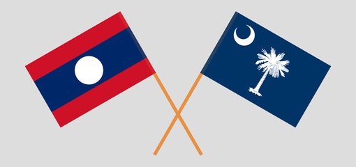 Crossed flags of Laos and The State of South Carolina. Official colors. Correct proportion