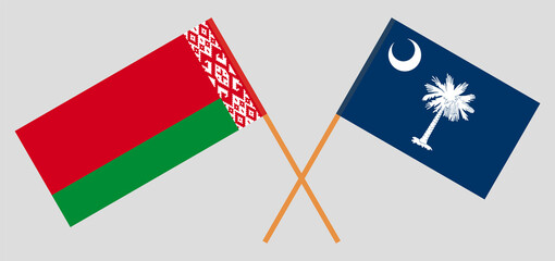 Crossed flags of Belarus and The State of South Carolina. Official colors. Correct proportion
