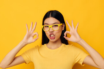 pretty brunette in glasses gesturing with hands copy-space isolated background unaltered