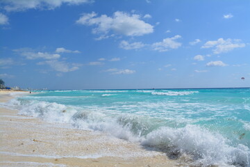 waves and sandy beach of the Caribbean sea