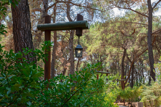 The Kursunlu Waterfall Nature Park is on one of the tributaries of the Aksu River and situated in the midst of a pine forest.decorative wooden street lamp.