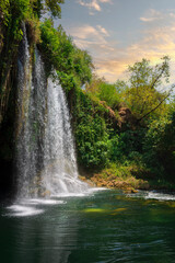 Fototapeta na wymiar Summer landscape with big waterfall. Duden waterfalls in Antalya. Side view.