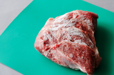 Large piece of frozen meat.