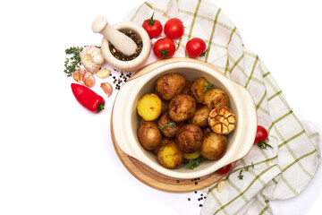 Baked potato in a clay pot isolated on white background