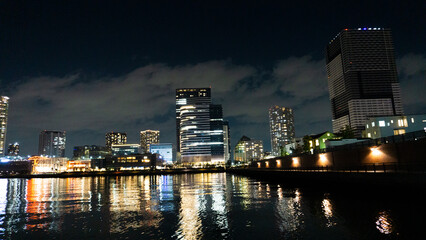 Fototapeta na wymiar Night view of a high-rise condominium along an urban river_05