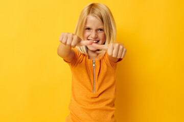 portrait of a little girl blonde straight hair posing smile fun isolated background unaltered