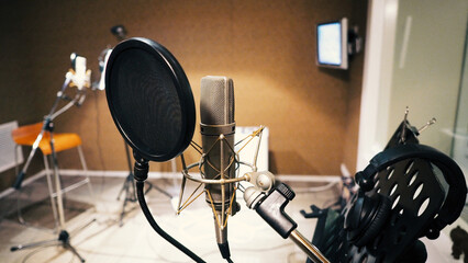 Microphone with pop filter and shock mount anti-vibration and note stand and tripod in music score...