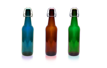 Three colored bottles on a white background ... 