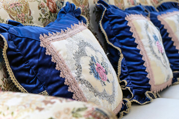 Detail image of Pillows on an antique luxury sofa