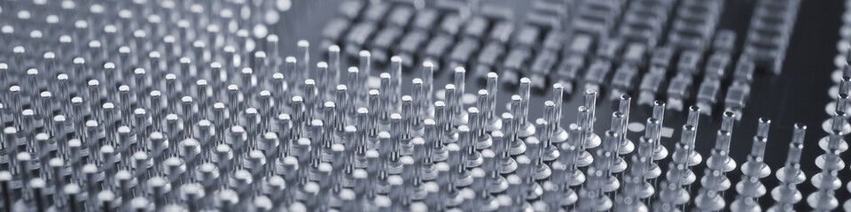 Computer processor close-up. Gray tinted banner. Information technology headline. A pattern of contacts and semiconductors of a PC microprocessor. Macro