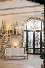 Cozy chalet lodge home interior with christmas tree and fireplace - luxury house inside on holiday. Christmas tree and fireplace at home in luxury chalet or lodge home interior design.