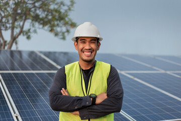 Engineer man smiling and crossed arms with solar panels energy. Technician checking and services of...