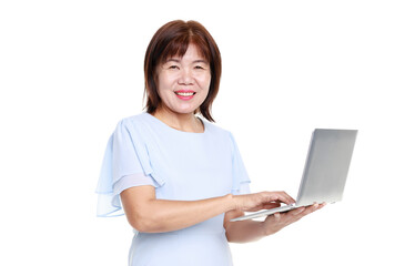 Studio closeup cutout isolated shot of Asian friendly senior grandmother female model in casual outfit standing smiling holding laptop computer typing surfing browsing internet on white background