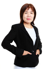 Portrait studio closeup cutout isolated shot Asian professional successful senior female businesswoman entrepreneur model in formal suit smiling posing hold hands in jacket pocket on white background