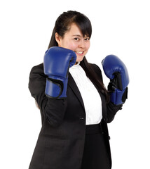 Portrait studio cutout isolated shot Asian young female businesswoman in formal suit with boxing gloves smiling holding fists up showing strong attitude to fight in business war on white background