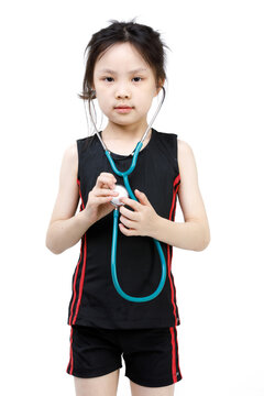 Portrait Studio Cutout Isolated Shot Asian Little Preschool Girl In Sport Wears Wearing Holding Stethoscope Pretending As Doctor Role In Hospital Listening To Patient Heartbeat On White Background