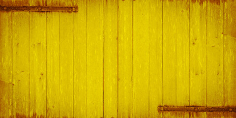 old yellow painted exfoliate rustic bright light wooden wall texture - wood background shabby chic