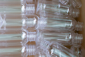 plastic water bottle,Dirty plastic bottles ,Jumble of clean empty plastic pet bottles on a blue...